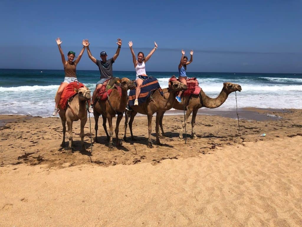 Riding camels on the beach in Morocco