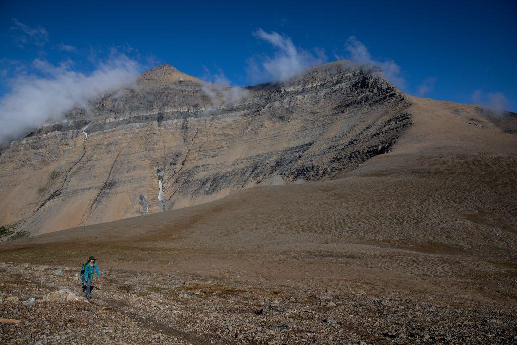 A person hiking on Siyeh Pass Trail in Glacier National Park